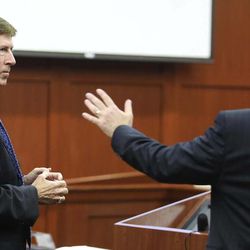 Defense attorney Mark O'Mara, left, listens to Assistant State Attorney Bernie de la Rionda during the pre-trial hearing for George Zimmerman, accused in the Trayvon Martin shooting, in Seminole circuit court in Sanford, Fla. on Saturday, June 8, 2013. 