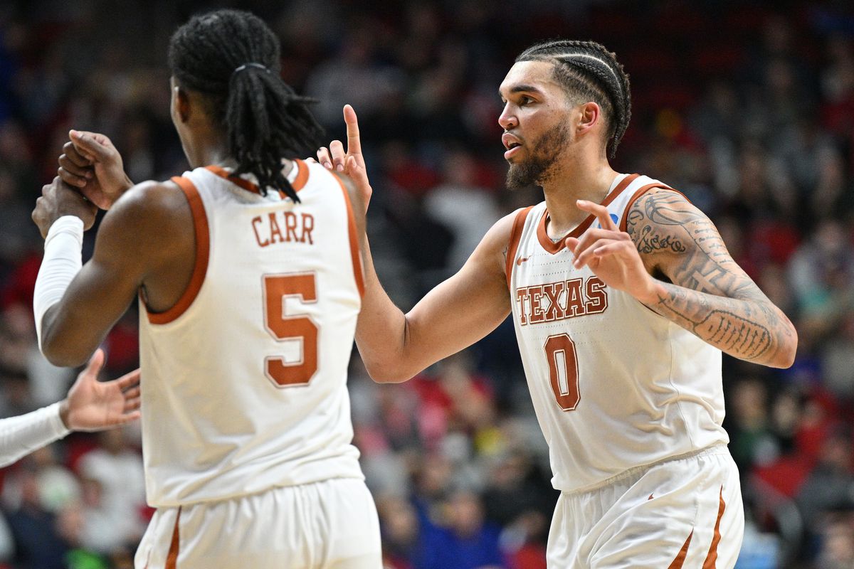 Mar 18, 2023; Des Moines, IA, USA; Texas Longhorns forward Timmy Allen (0) celebrates with guard Marcus Carr (5) during the second half against the Penn State Nittany Lionsat Wells Fargo Arena. Mandatory Credit: Jeffrey Becker