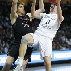 Brigham Young Cougars guard Zac Seljaas (2) is fouled by Santa Clara Broncos forward Nate Kratch (43) during the WCC tournament in Las Vegas Saturday, March 5, 2016. BYU won 72-60. 