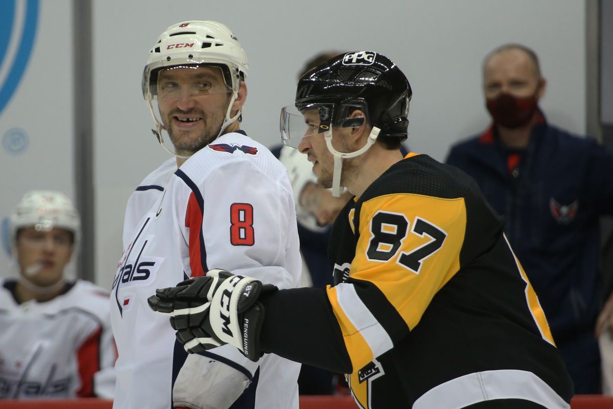 Washington Capitals left wing Alex Ovechkin reacts as he talks with Pittsburgh Penguins center Sidney Crosby during the second period at the PPG Paints Arena. Pittsburgh won 4-3 in overtime.