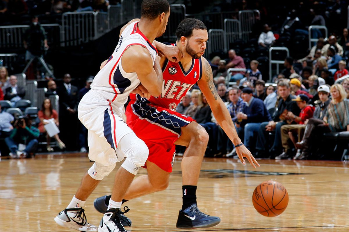 ATLANTA, GA - DECEMBER 30:  Jannero Pargo #7 of the Atlanta Hawks defends against Deron Williams #8 of the New Jersey Nets at Philips Arena on December 30, 2011 in Atlanta, Georgia.  (Photo by Kevin C. Cox/Getty Images)