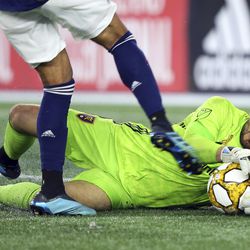 Real Salt Lake goalkeeper Andrew Putna (51) makes a save on a shot by New England Revolution forward Teal Bunbury, left, during the second half of an MLS soccer match at Gillette Stadium, Saturday, Sept. 21, 2019, in Foxborough, Mass. 