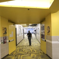 Jaime Chavez, a custodian at Midvale Middle School, works his way through the school as he disinfects surfaces on Monday, March 16, 2020. On Friday Utah Gov. Gary Herbert and state health and education officials closed schools for two weeks to help stop the spread of COVID-19.