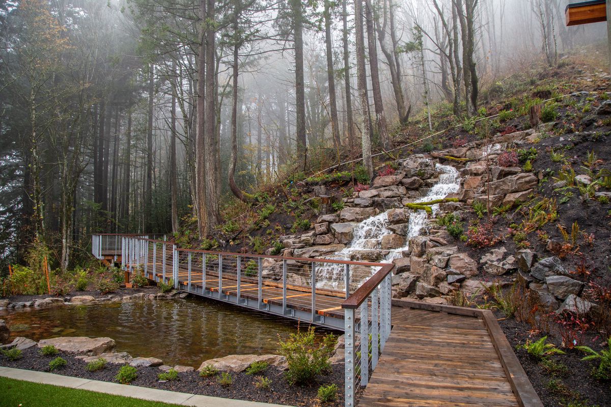 A walkway on Amaterra’s estate serves as a bridge over a small creek