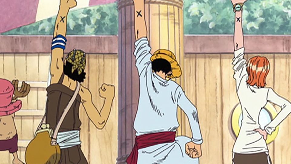 An image of Luffy, Usopp, and Nami holding their fists up in the anime, One Piece. 