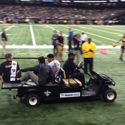 Jonathan Goodwin gets carted off the field. 