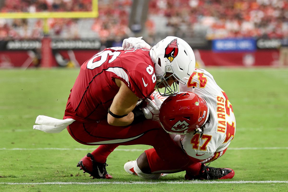 Tight end Zach Ertz #86 of the Arizona Cardinals scores a touchdown as linebacker Darius Harris #47 of the Kansas City Chiefs defends during the fourth quarter of the game at State Farm Stadium on September 11, 2022 in Glendale, Arizona.