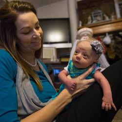 Bobbisue Christensen, holds her 6-week-old daughter, Ruthann, at their home in Brigham City on Tuesday, Dec. 29, 2015. Ruthann has a twin brother named Martin.