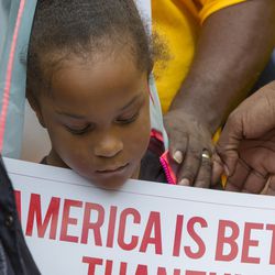 A crowd gathers for a rally outside Bethany Christian Services in Grand Rapids on Wednesday, June 27, 2018, to protest the separation of immigrant children from their families at the southern border. Some of the children are currently being housed at BCS. (Cory Morse/The Grand Rapids Press via AP)