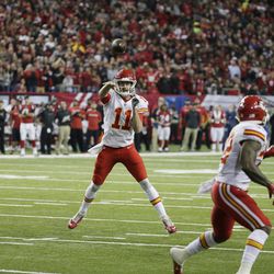 Kansas City Chiefs quarterback Alex Smith (11) throws the ball to Kansas City Chiefs running back Spencer Ware (32) against the Atlanta Falcons during the first half of an NFL football game, Sunday, Dec. 4, 2016, in Atlanta. Ware scored a touchdown on the play. (AP Photo/Chuck Burton)