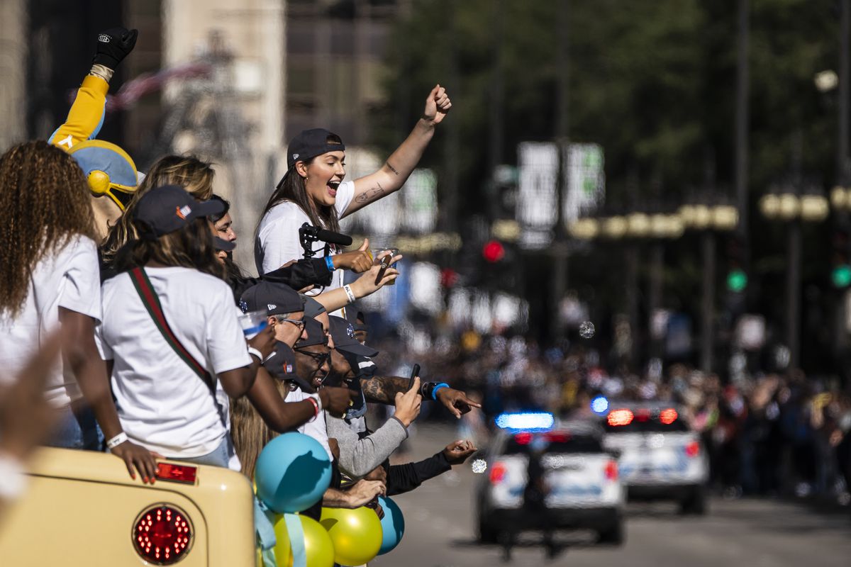 Stefanie Dolson, her teammates and supporters cheer as the Chicago Sky buses parade down Michigan Avenue in the Loop to celebrate the WNBA Championship title.