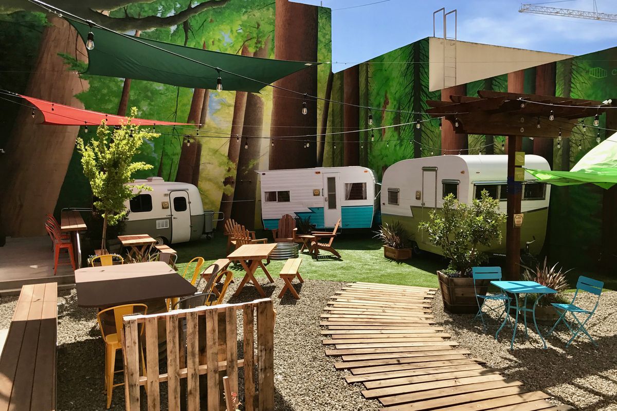 An outdoor coworking space with trailers and benches called Outcamp in San Francisco. 
