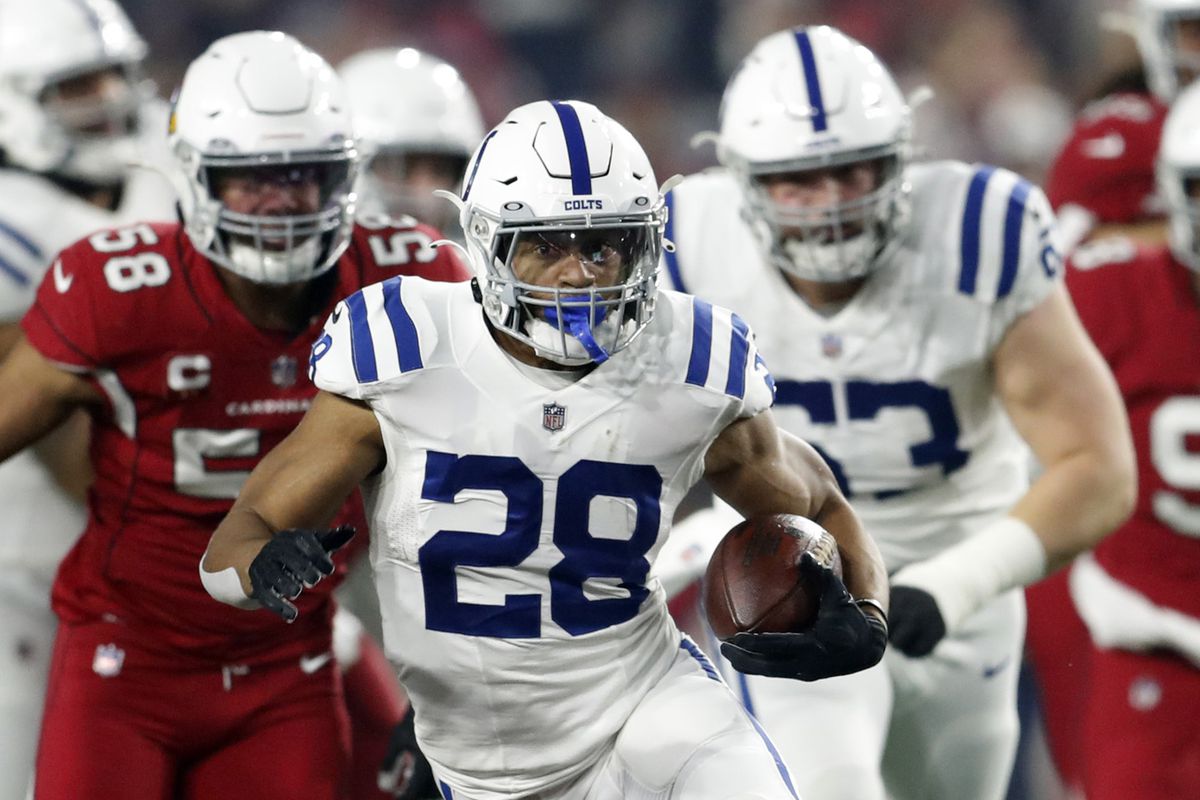 Running back Jonathan Taylor #28 of the Indianapolis Colts runs during the first half of the game against the Arizona Cardinals at State Farm Stadium on December 25, 2021 in Glendale, Arizona. The Colts beat the Cardinals 22-16.