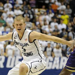 BYU guard Tyler Haws (3) drives around the defense of Prairie View A&M Panthers forward Rasi Jenkins (22) during a game at the Marriott Center in Provo on Wednesday, Dec. 11, 2013.