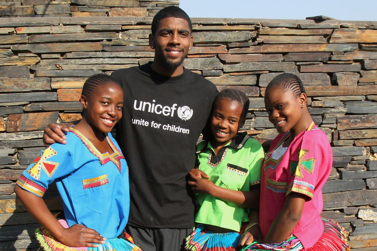 Kyrie Irving participates in a UNICEF basketball clinic