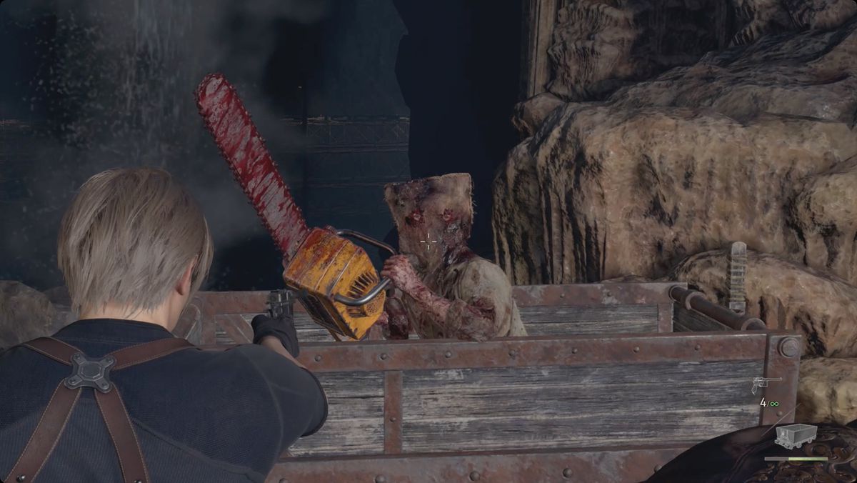 Resident Evil 4&nbsp;remake&nbsp;Leon aiming at a chainsaw villager in a mine cart