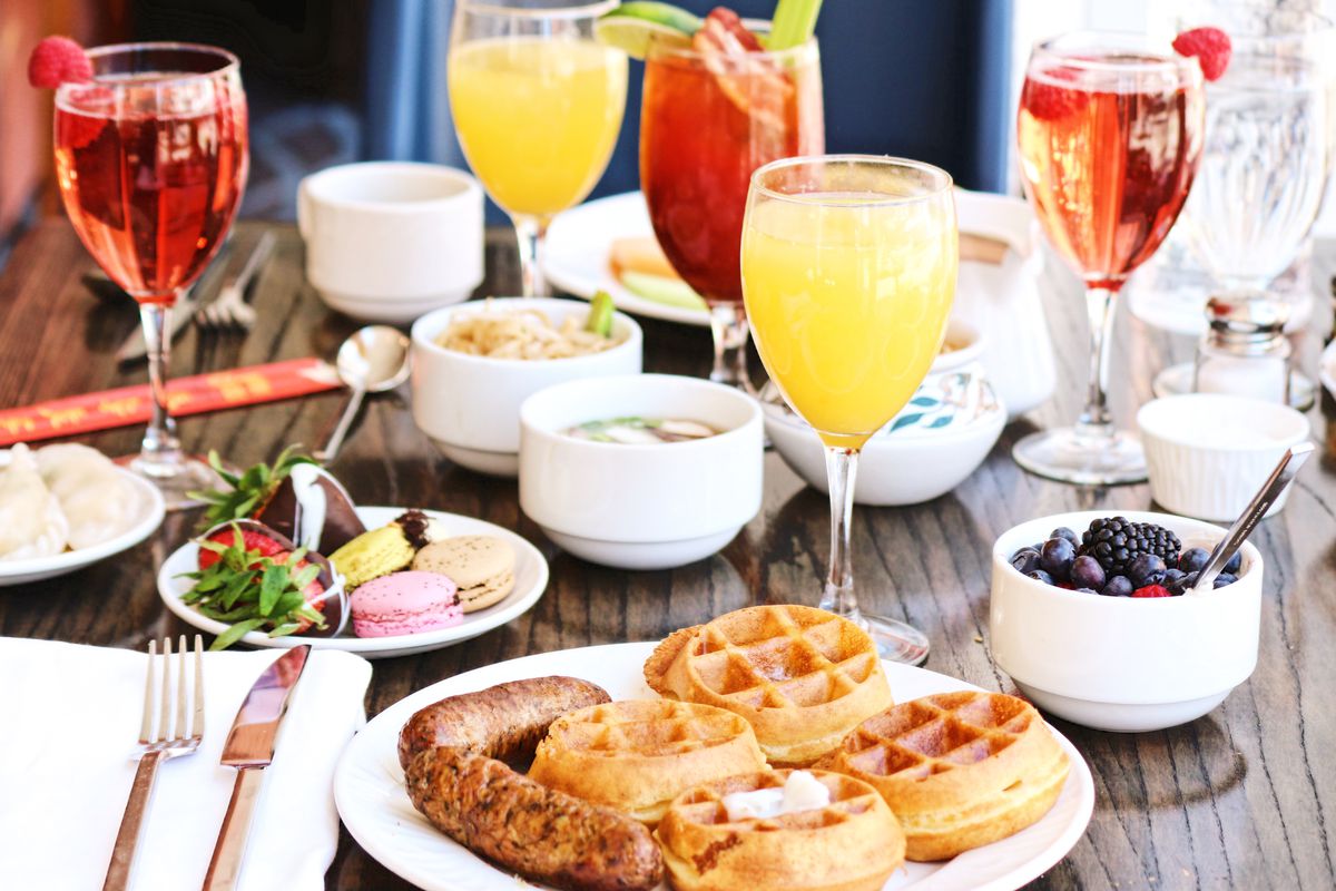 A brunch set-up with waffles and mimosas.