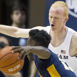 Brigham Young guard TJ Haws (30) guards Coppin State guard Dejuan Clayton (13) during an NCAA college basketball game in Provo on Thursday, Nov. 17, 2016.