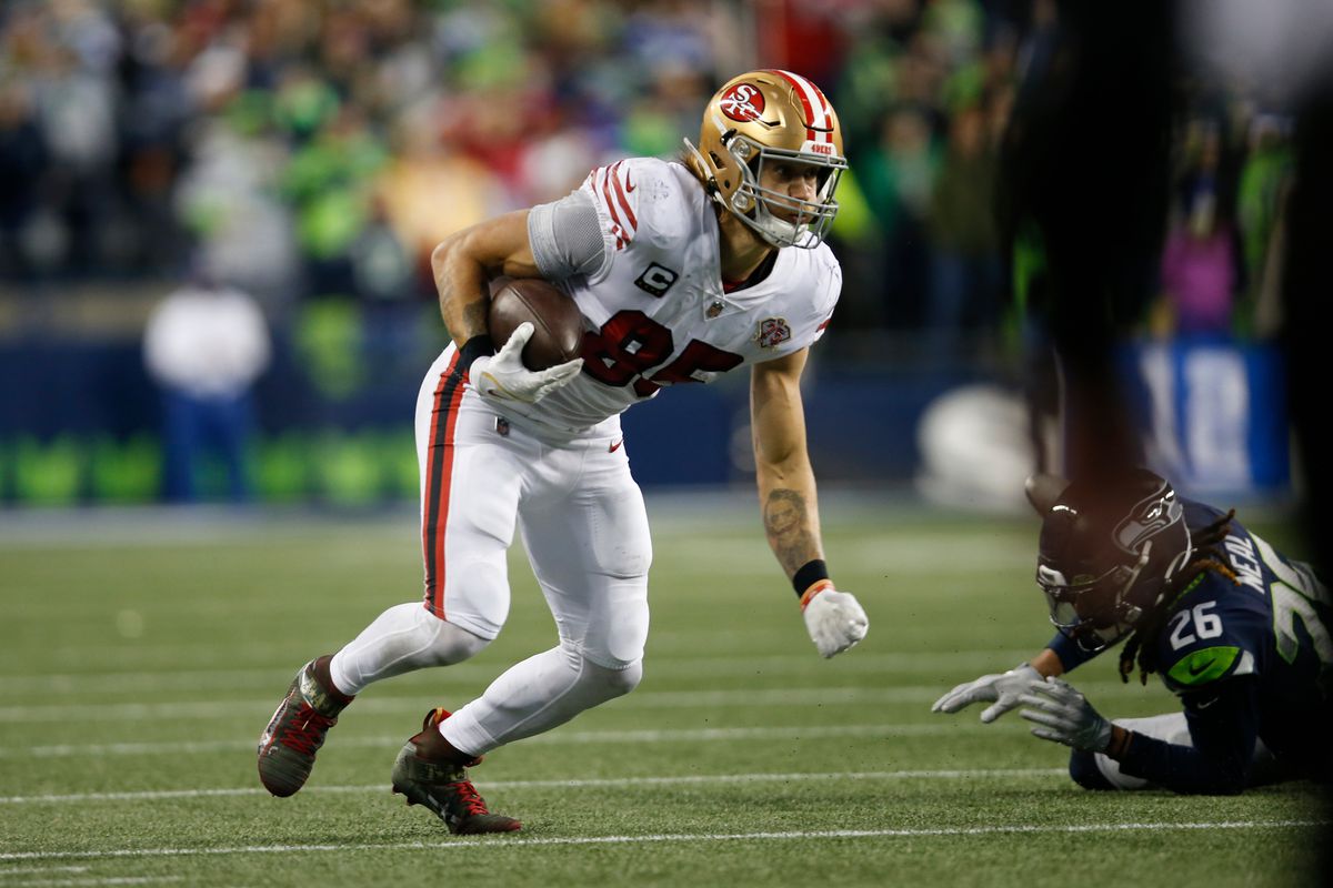 George Kittle #85 of the San Francisco 49ers runs after making a catch during the game against the Seattle Seahawks at Lumen Field on December 5, 2021 in Seattle, Washington.&nbsp;