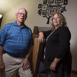 Frank Arnold Horton and his daughter, Suzanne Rengers, who say they were both scammed by their tax preparer and financial manager, pose for a photo at Rengers' home in West Jordan on Tuesday, Sept. 27, 2016.