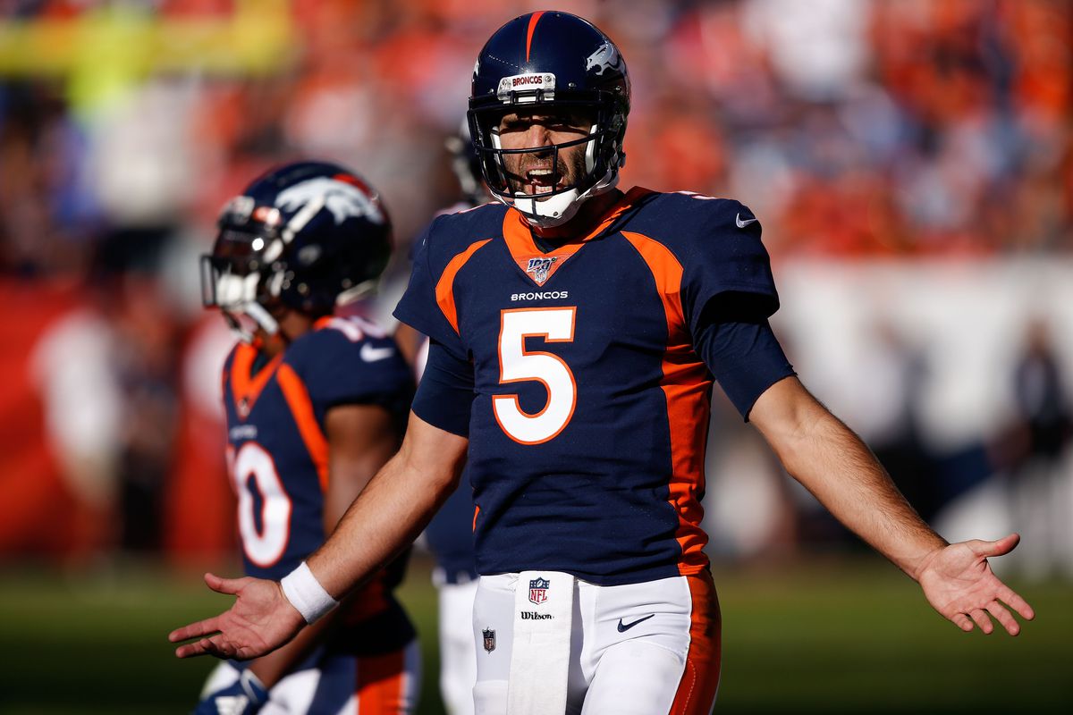 Denver Broncos quarterback Joe Flacco reacts after a call in the second quarter against the Tennessee Titans at Empower Field at Mile High.