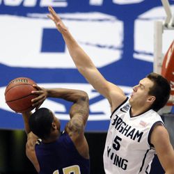 BYU guard Kyle Collinsworth (5) applies pressure to Prairie View A&M Panthers guard John Brisco (12) during a game at the Marriott Center in Provo on Wednesday, Dec. 11, 2013.
