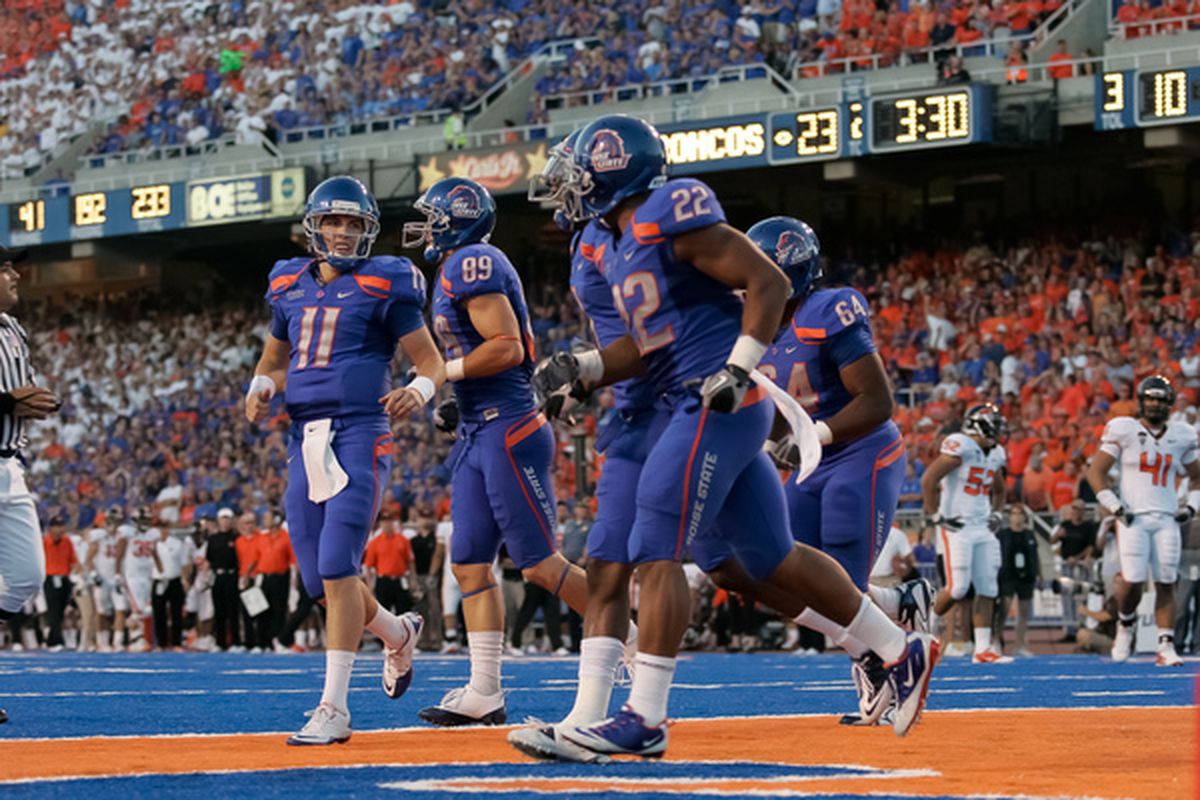 BOISE ID - SEPTEMBER 25:  Quarterback Kellen Moore #11 and the Boise State Broncos celebrates a touchdown against the Oregon Stage Beavers at Bronco Stadium on September 25 2010 in Boise Idaho.  (Photo by Otto Kitsinger III/Getty Images)