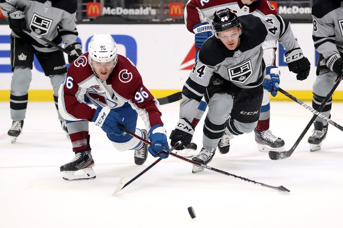 MAY 08: Mikko Rantanen #96 of the Colorado Avalanche and Mikey Anderson #44 of the Los Angeles Kings battle for control of the puck during the first period at Staples Center on May 08, 2021 in Los Angeles, California.