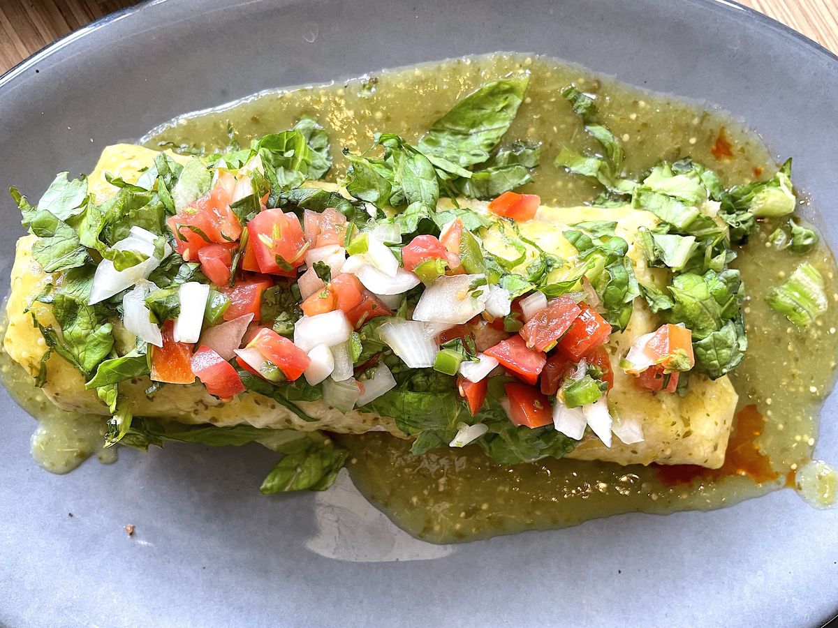 El Chingon’s chorizo breakfast burrito smothered in salsa verde