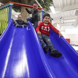 Elijah Sotelo, 3, right, and at Owen Butler, 6, play during physical therapy with pediatric physical therapist Rick Reigle at Neuroworx in Sandy on Friday, March 8, 2019. Elijah has been attending therapy at Neuroworx since 2016 after a head injury caused the left side of his brain to stroke, leaving him with neglect on the right side of his body. Owen has been going to therapy at Neuroworx for the past year to treat the side effects of cerebral palsy.