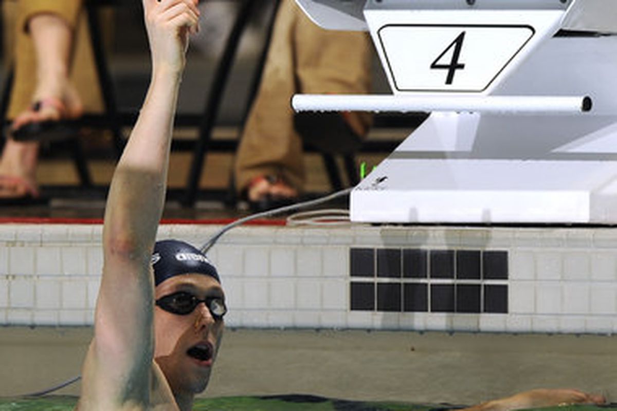 Auburn Swimmer Kyle Owens celebrates after winning his second SEC Championship in the 200 yard back stroke. Owens won one silver and six gold medals during the 2012 SEC Championship meet.