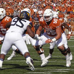 FILE - In this Nov. 12, 2016, file photo, Texas lineman Connor Williams (55) blocks against West Virginia lineman Christian Brown during the first half of an NCAA college football game, in Austin, Texas. Williams was named to the AP Preseason All-America Team on Tuesday, Aug. 22, 2017. 