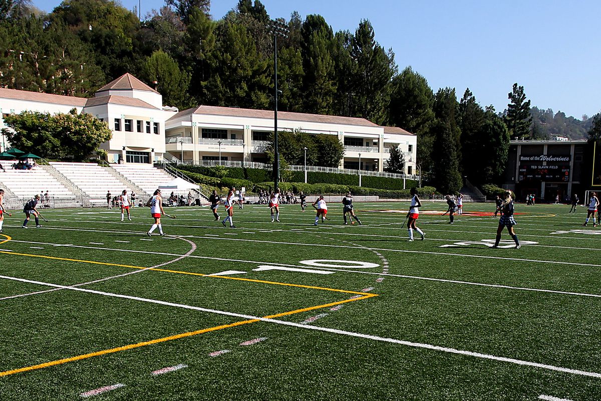 Girls play a game of field hockey on the athletic fields of Harvard-Westlake School, an independen
