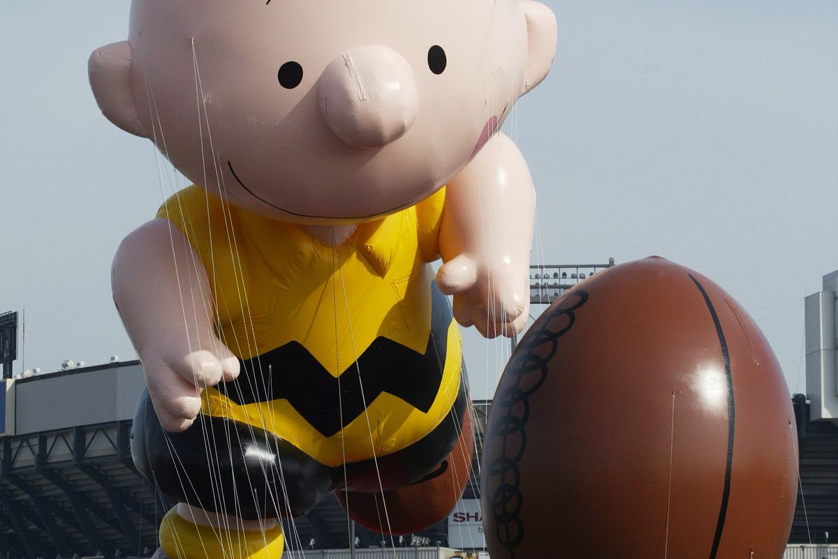 Handlers keep a tight rein on Charlie Brown and his football