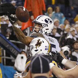 Teh ball get tipped in the endzone resulting in a touchdown for Brigham Young Cougars tight end Tanner Balderree (89) during the Poinsettia Bowl in San Diego on Wednesday, Dec. 21, 2016. BYU won 24-21.