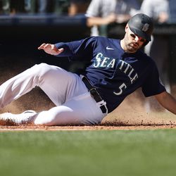 SEATTLE, WASHINGTON - SEPTEMBER 07: Curt Casali #5 of the Seattle Mariners scores against the Chicago White Sox during the third inning at T-Mobile Park on September 07, 2022 in Seattle, Washington