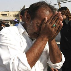 A man mourns after a bomb explosion in Karachi, Pakistan on Feb. 5, 2010.
