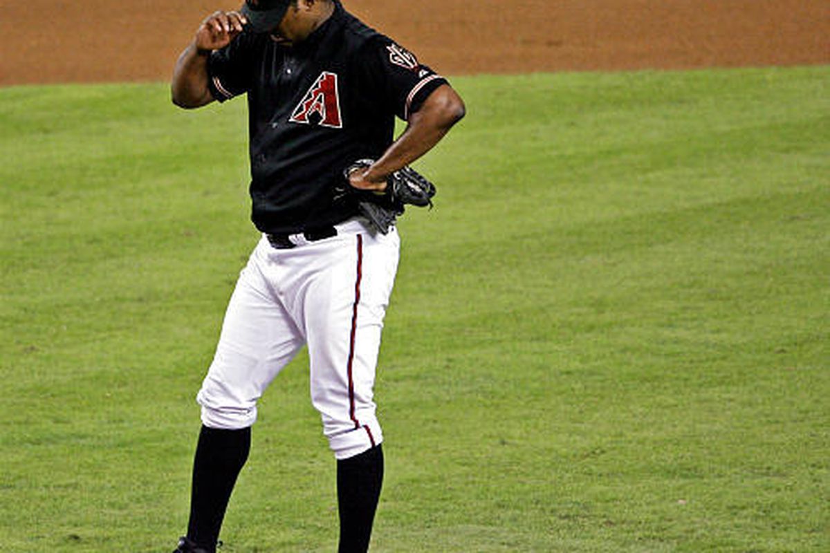 Arizona Diamondbacks pitcher Jose Valverde reacts after he walked in the game-winning run during the 11th inning in Game 2.