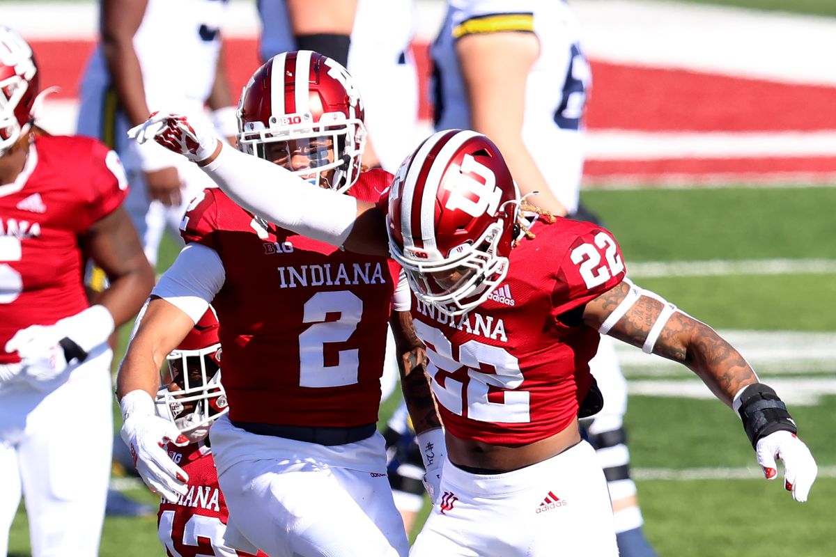 Jamar Johnson #22 and Reese Taylor #2 of the Indiana Hoosiers celebrate after a play in the game against the Michigan Wolverines at Memorial Stadium on November 07, 2020 in Bloomington, Indiana.
