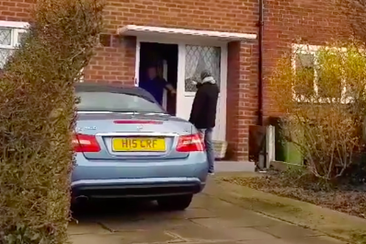 Screenshot from video of a Newcastle fan laughing in the face of his Everton-supporting friend at the friend’s front door. 