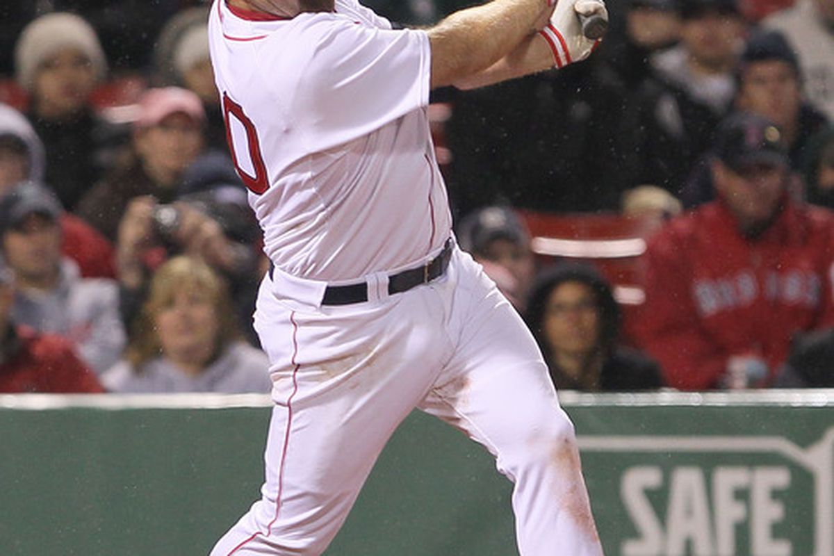 BOSTON - APRIL 17:  Kevin Youkilis #20 of the Boston Red Sox hits a home run against the Tampa Bay Rays at Fenway Park on April 17, 2010 in Boston, Massachusetts. (Photo by Jim Rogash/Getty Images)