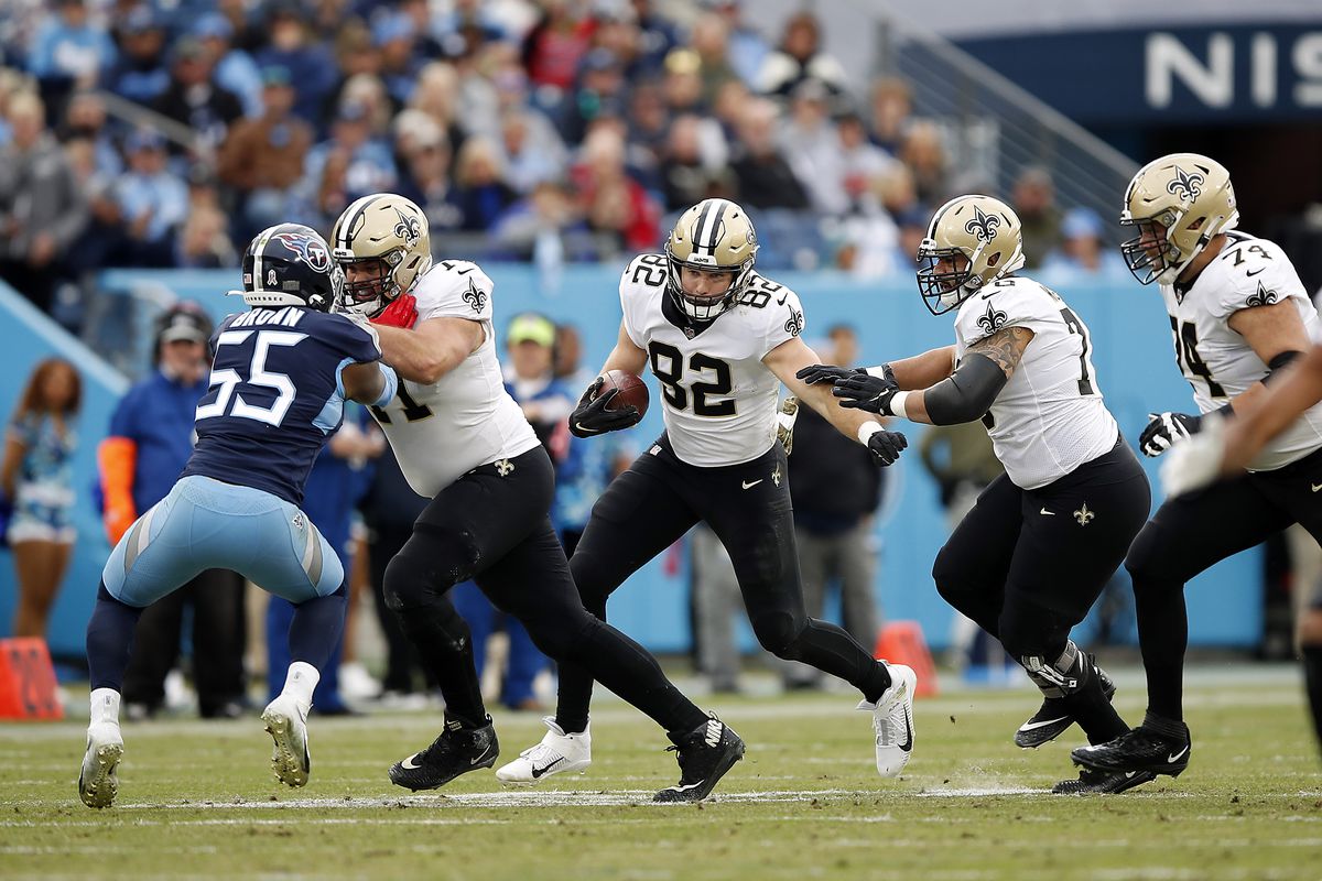 Adam Trautman #82 of the New Orleans Saints runs with the ball against the Tennessee Titans in the first quarter at Nissan Stadium on November 14, 2021 in Nashville, Tennessee.