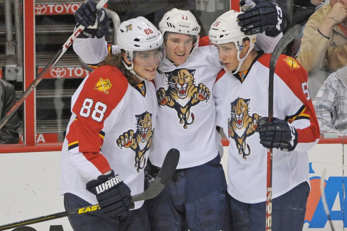 That's hockey, baby: Jonathan Huberdeau (center) with linemates Peter Mueller (88) and fellow rookie Drew Shore 