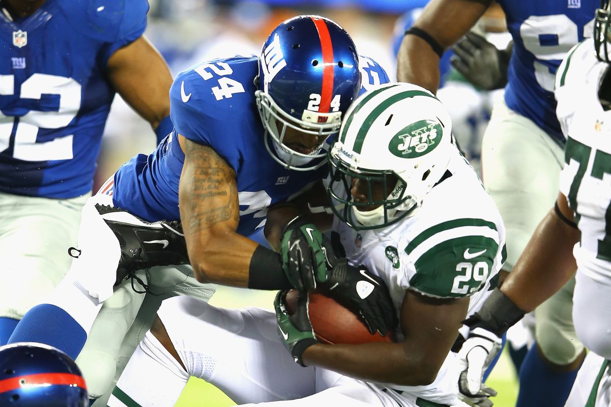 Terrell Thomas tackles Bilal Powell of the Jets during Saturday night's game.