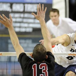 BYU's Josue Rivera (6) gets a kill around Stanford's Eric Mochalski (13) during a match against the StanfordCardinal Friday, Jan. 24, 2014, at the Smith Fieldhouse in Provo.