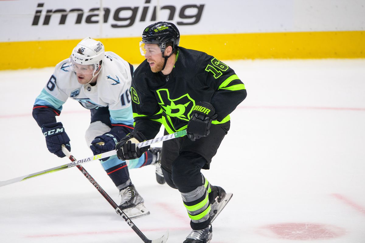 Apr 23, 2022; Dallas, Texas, USA; Seattle Kraken left wing Jared McCann (16) and Dallas Stars center Joe Pavelski (16) chase the puck during the third period at the American Airlines Center.