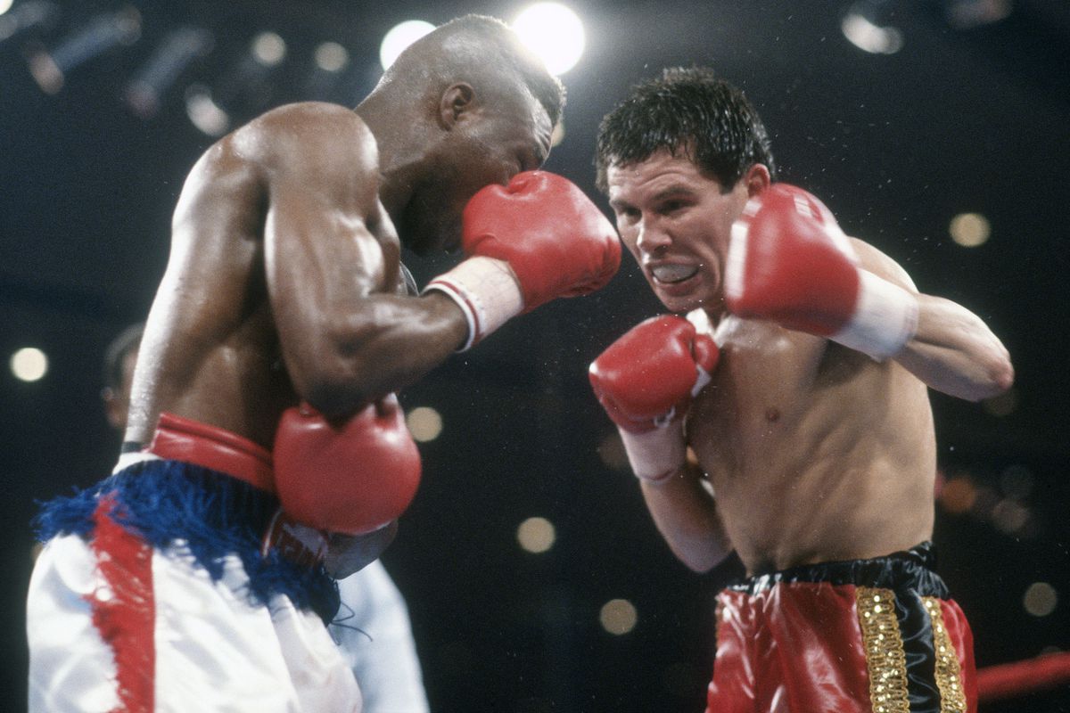 Julio Cesar Chavez and Meldrick Taylor unified 140 lb titles in a controversial bout in 1990