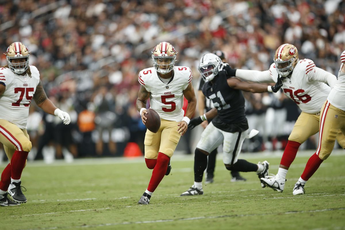 Trey Lance of the San Francisco 49ers scrambles during the game against the Las Vegas Raiders at Allegiant Stadium on August 13, 2023 in Las Vegas, Nevada. The Raiders defeated the 49ers 34-7.