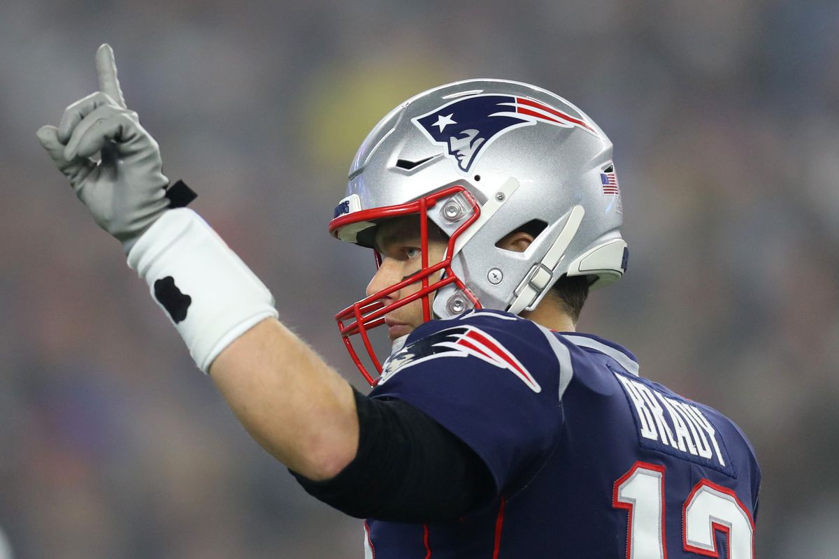 Tom Brady of the New England Patriots signals to teammates during the AFC Wild Card Playoff game against the Tennessee Titans at Gillette Stadium on January 04, 2020 in Foxborough, Massachusetts.