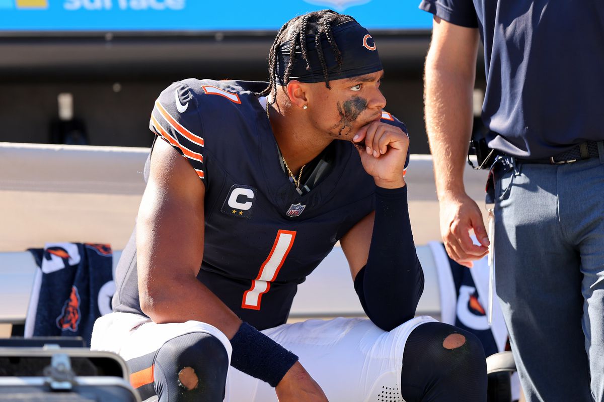 CHICAGO, ILLINOIS - OCTOBER 01: Justin Fields #1 of the Chicago Bears sits on the bench after the game against the Denver Broncos at Soldier Field on October 01, 2023 in Chicago, Illinois. Denver defeats Chicago 31-28.